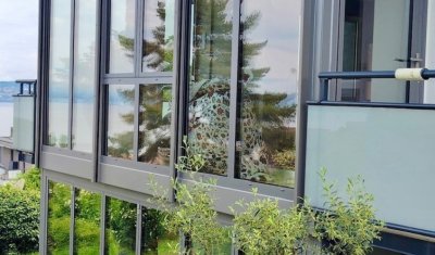 Conception d'une extension entièrement vitrée sur deux niveaux avec une magnifique vue sur le lac Léman (74)