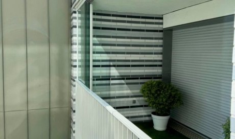 Fermeture de terrasse avec système coulissant tout verre : profiter de sa terrasse plus longtemps à Lyon!